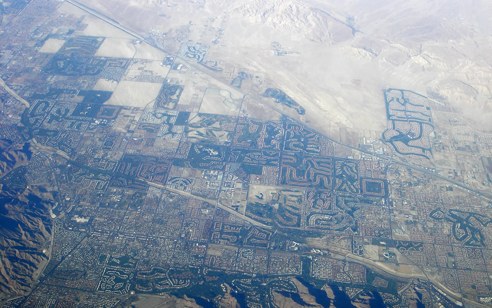 Aerial view of the Coachella Valley showing development, golf courses, and desert landscape near Palm Springs and Palm Desert
